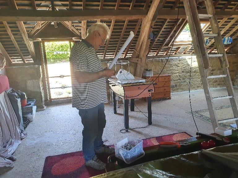 Rick installing lighting in the loft