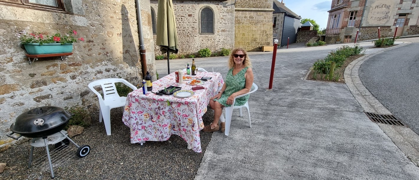 Sue posing by barbecue